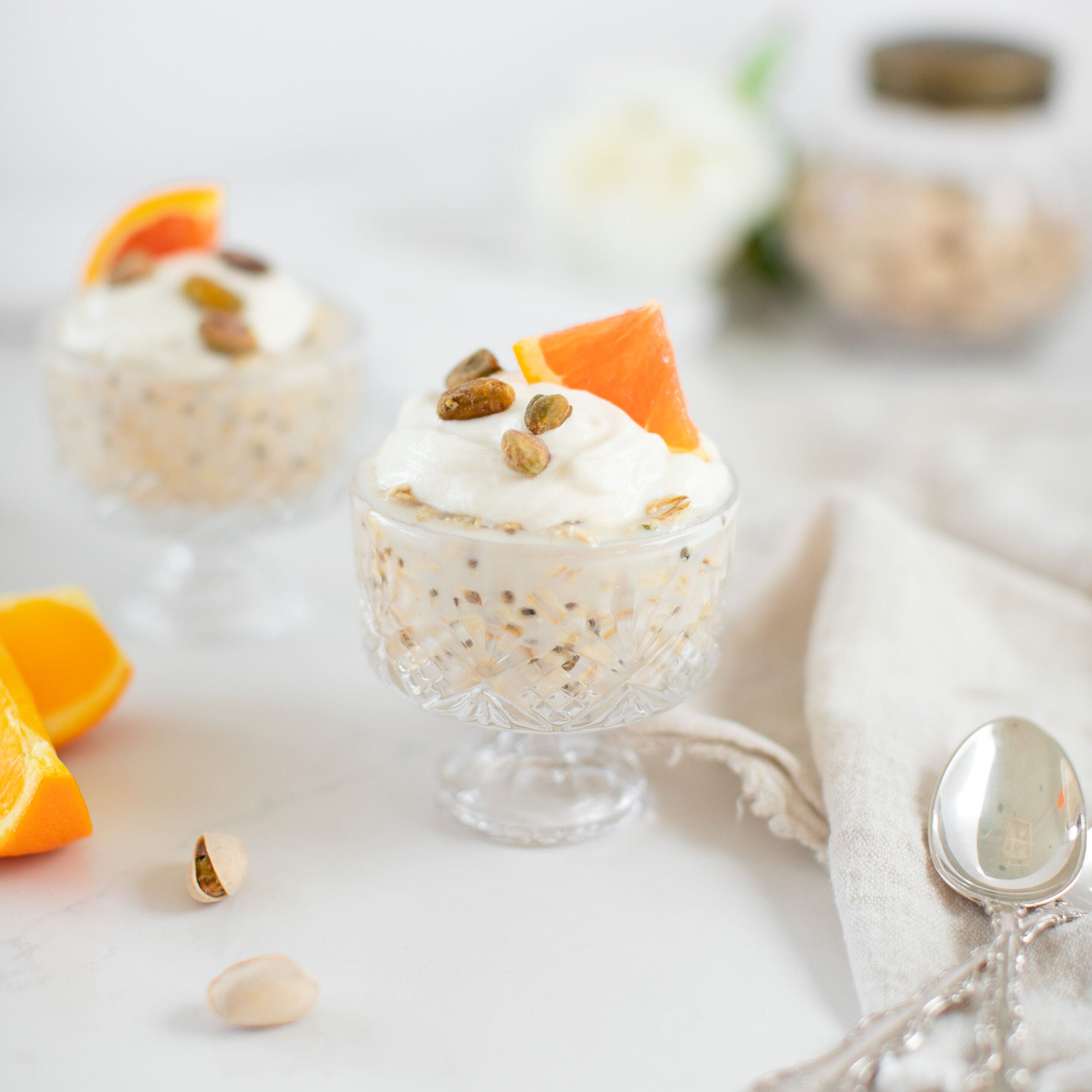 two dishes of overnight oats with pistachios and orange