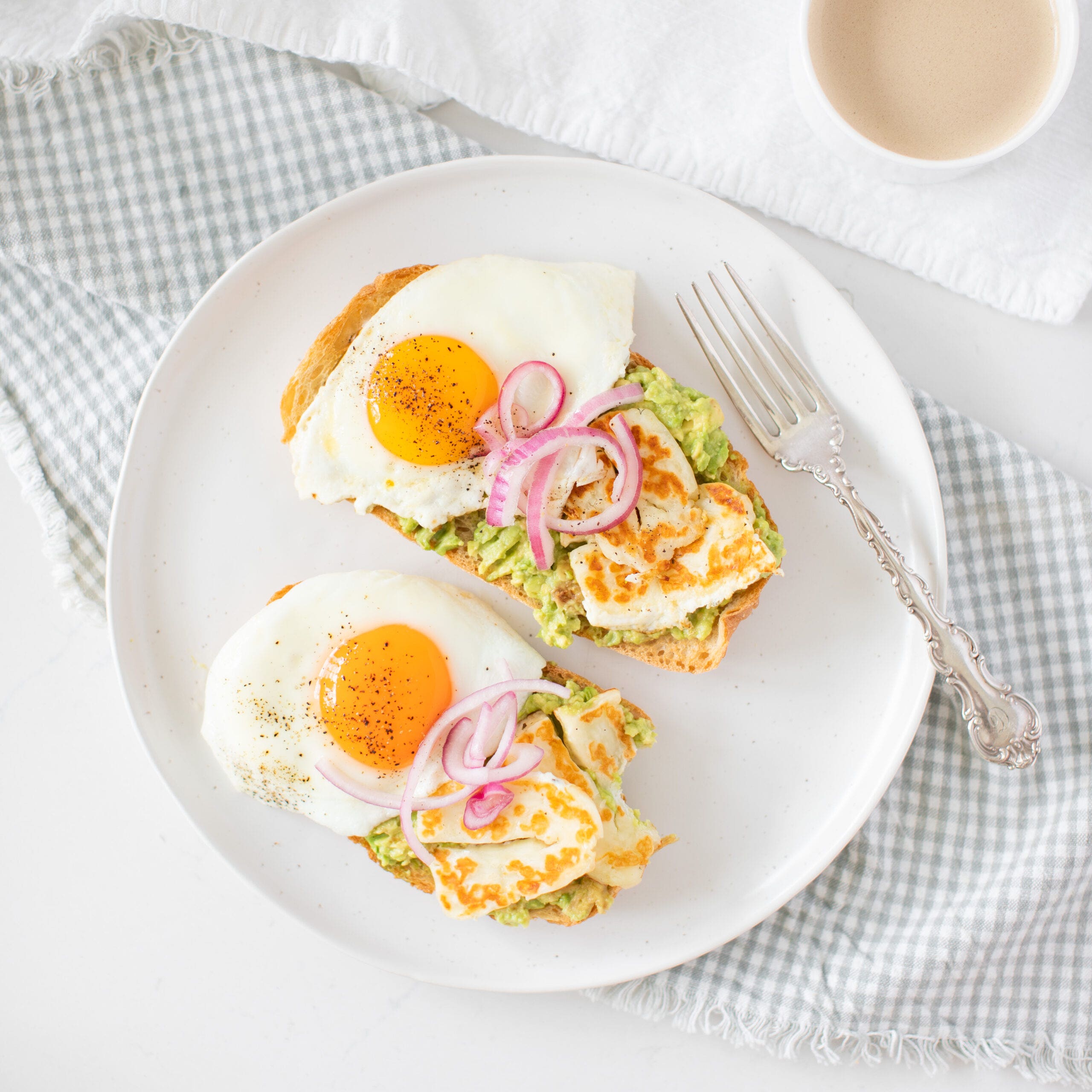 overhead of avocado and halloumi on toast