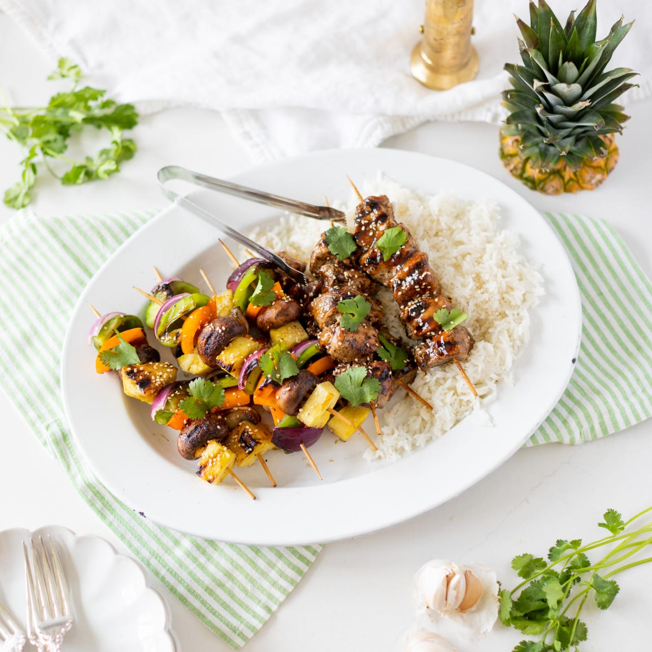 mixed vegetable skewer and pork skewer with rice