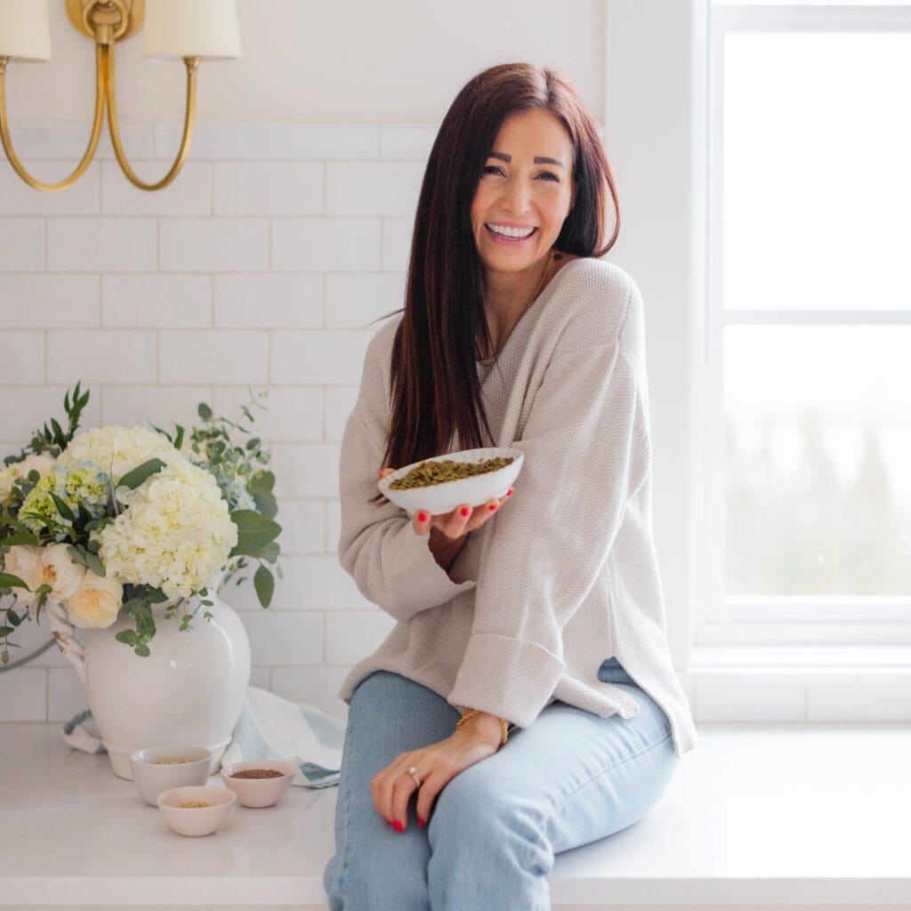 Tori Wesszer Dietitian, sitting on kitchen counter