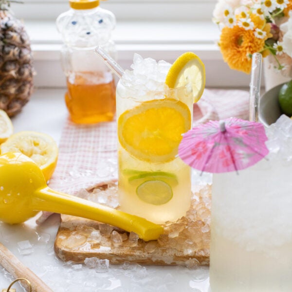 Citrus homemade gatorade with slices of lemon and lime added to the glass