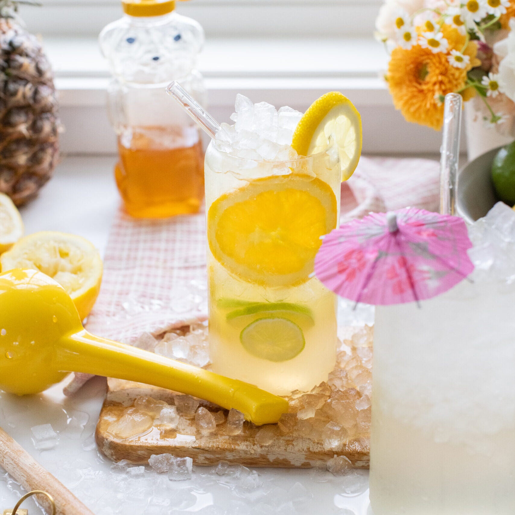 Citrus homemade gatorade with slices of lemon and lime added to the glass